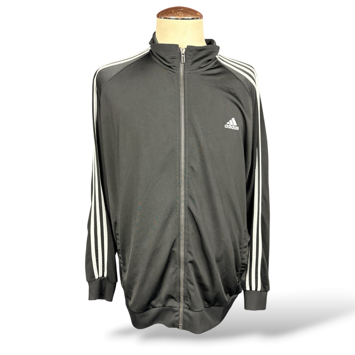 Front of black Adidas track jacket with white sleeve stripes
